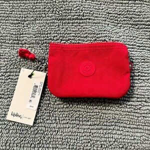 Kipling Creativity Small Red Mini Pouch - NWT
Color: Red Rouge